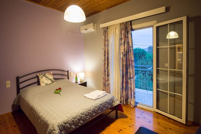 magicians-apartments-lefkada-kaligoni-bedroom-double-bed-balcony