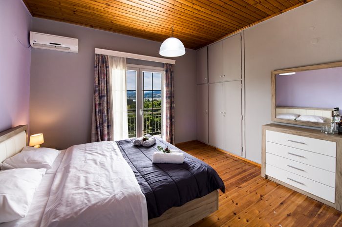 magicians-apartments-lefkada-kaligoni-bedroom-double-bed-view-balcony